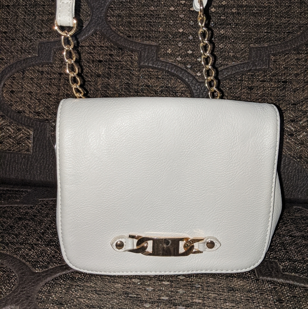 Small white purse with gold embellishment